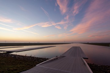 Pathway towards the water for rowing courses under a blue sky