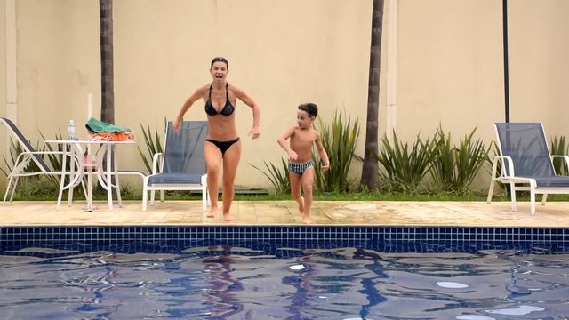 Gabi and Lina jumping in the pool - 01_19_2020