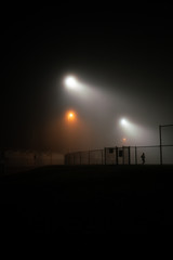 Night scene of runner in fog