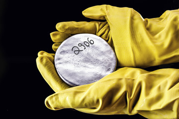 A highly enriched uranium billet. Highly radioactive material used in nuclear research, risk of political crisis. Nuclear weapon, danger of nuclear war.