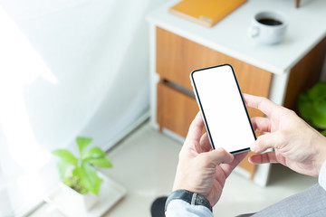 cell phone Mockup image blank white screen.man hand holding texting using mobile.background empty space for advertise text.people contact marketing business,technology 