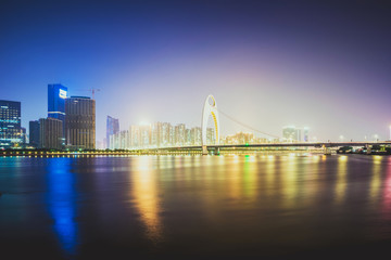 night skyline and modern cityscape in guangzhou at riverside