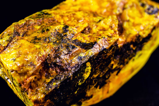 production of enriched uranium. Uranium ore found in nature. Yellow and radioactive stone. Risk of radiation.