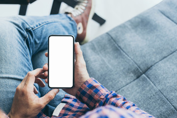Mockup image blank white screen cell phone.hand holding texting using mobile background empty space for advertise text.people contact marketing business,technology 