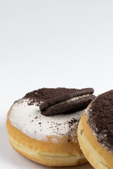 Chocolate and cream donut. close up on white background