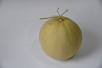 melon fruit on white ground