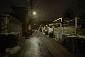 Dark and eerie urban city alley at night 