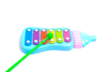 A high key picture of toy xylophone on white background. Music helps to stimulate baby reaction and good for brain.