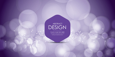 Blurred bokeh light on dark purple background. Christmas and New Year holidays template.