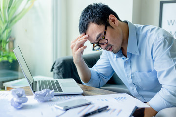 serious people frustrated exhausted work stress concept.businessman holding hands on face feeling tired suffering working on  paperwork job in work place.concept global economic problems