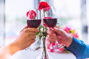 Romantic still life with pink champagne and beautiful red roses. Valentine's day concept. Soft focus