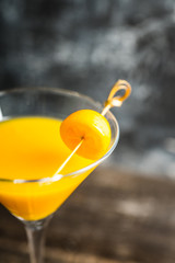 Sweet cocktail with kumquats on rustic background. Selective focus. Shallow depth of field.