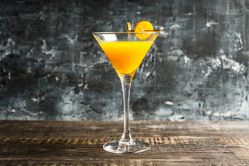 Sweet cocktail with kumquats on rustic background. Selective focus. Shallow depth of field.