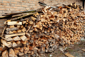 Firewood piled next to house