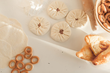 Obraz na płótnie Canvas cooking traditional national dish, yeast dough, flour, women hands, top view