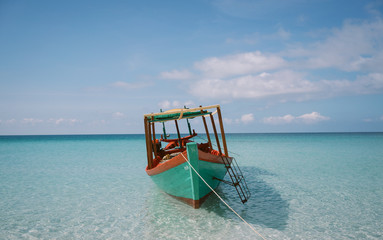 Long Tail Fishing Boat on Tropical Beach