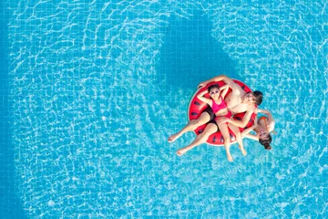 Fotobehang Asian family relax in swimming pool © anekoho