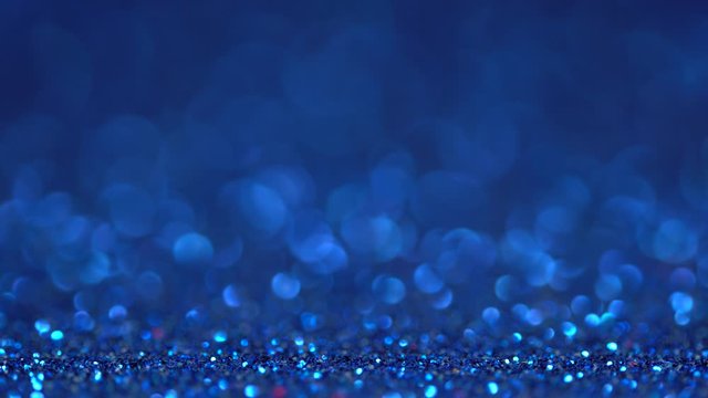 Classic blue glitter festive defocused lights background