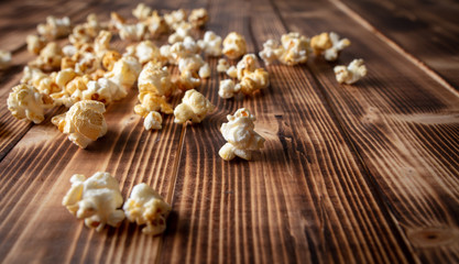 Obraz na płótnie Canvas Popcorn flakes on a wooden background