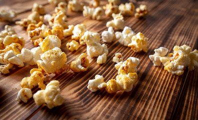 Popcorn flakes on a wooden background