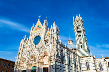 Siena Cathedral at a bright sunny day, in Siena, Italy.