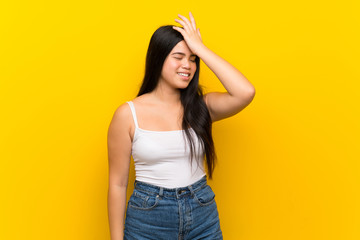 Young teenager Asian girl over isolated yellow background has realized something and intending the solution