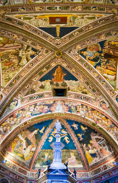Siena, Italy - CIRCA 2013: Baptistery of Saint John (Battistero di San Giovanni) ceiling interior in Siena Cathedral complex.