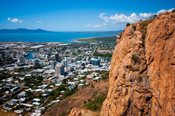 Scenic view at the Castle Hill Lookout at Townsville (Queensland, Australia) to the cliff, town, coast line and Magnetic Island.