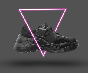 Black sneaker. 80's synth wave and retrowave glowing triangle futuristic aesthetics. Old fashioned...