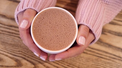 Hot Chocolate In Woman Hand Wearing Knit Sweater
