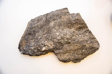 Antimonite stone, isolated on a white background, gray color.