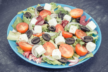 Greek salad with feta cheese and vegetables. Healthy lifestyles, food and nutrition concept