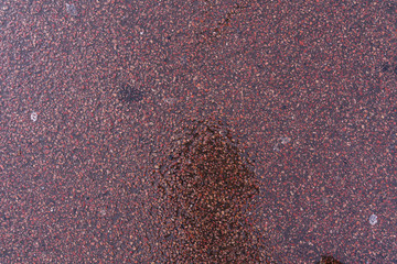 wet asphalt. gray coarse fabric