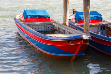 red and blue pleasure boat