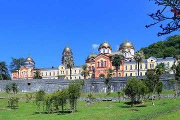 Fototapeta na wymiar New Athos monastery is on the background of blue sky in the Republic of Abkhazia