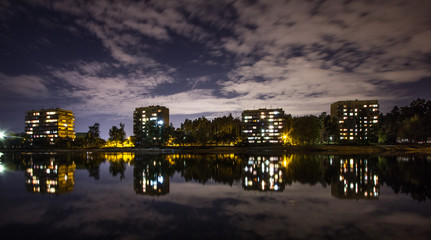 lights of city reflects in lake