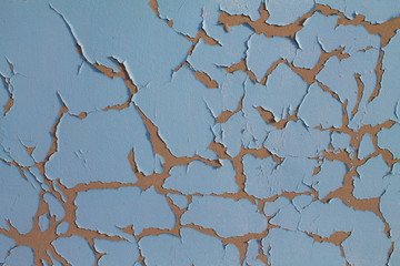 Blue wall with cracks