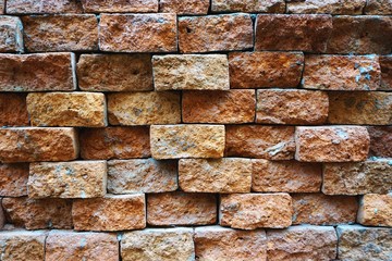 Closeup detail of uneven brick wall horizontal background