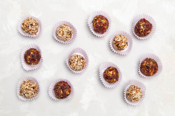 Healthy raw energy ball snack on neutral grey background