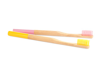 Natural bamboo toothbrushes with soft bristles isolated on white