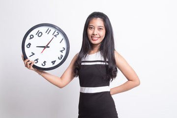 Young Asian woman with a clock.