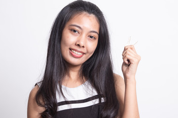Cute asian girl showing home residence keys.