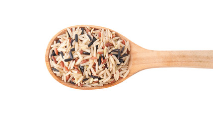 Mix of different brown rice in wooden spoon isolated on white, top view