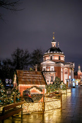 Moscow, Russia, Varvarka street. Christmas decor and illumination on the background of the Barbarian Church - 317894017