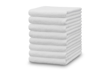 Stack of white plush hotel towels isolated on white background