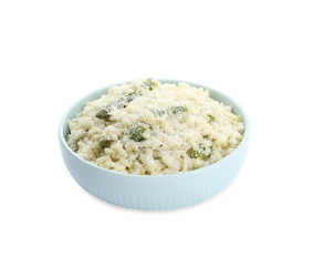 Delicious risotto with asparagus isolated on white