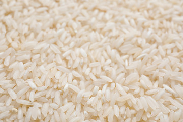 Pile of polished rice as background, closeup