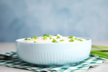 Fresh sour cream with onion on fabric