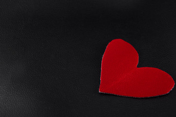 big red hearts on black skin close up of copyspace