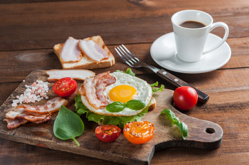 Coffee and fried eggs with bacon